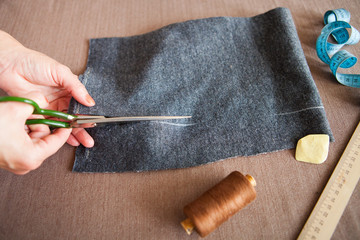 Tailor- woman working in his home tailor atelier