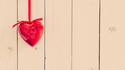 Decorative red hearts hanging on vintage wooden with space. Vale