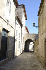 Small arch in picturesque alley in Tui, Galicia, Spain