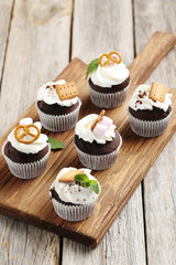 Chocolate cupcakes on a grey wooden table