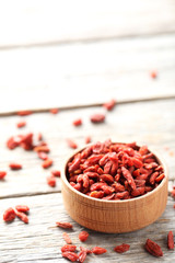 Dry goji berries on grey wooden table