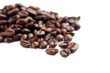 Roasted coffee beans on a white background