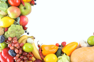 Obraz na płótnie Canvas Ripe and tasty fruits and vegetables on a white background