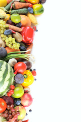 Ripe and tasty fruits and vegetables on a white background