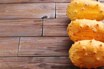 Kiwano fruit on brown wooden table