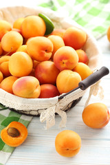 Ripe apricots fruit on white wooden table