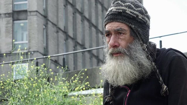 real homeless living in the street and waiting for charity 