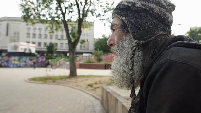 lonely old man living in the street by asking charity and begging 