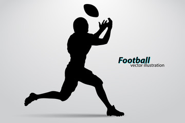 Fototapeta na wymiar silhouette of a football player. Rugby. American footballer