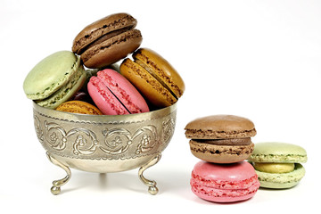 colorful macarons in a silver bowl isolated on white background - Powered by Adobe