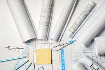 Workplace of architect - rolls and plans.
