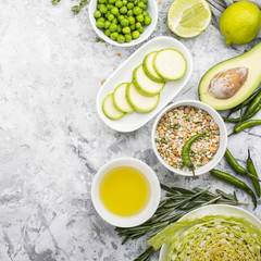 Fresh green vegetables and herbs. Ingredients for the seasonal dishes. The concept of organic natural food. Top view