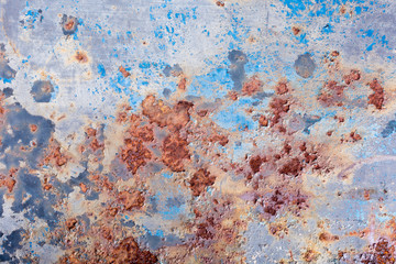Blue peeling paint and rusty old metal background, texture. Horizontal.