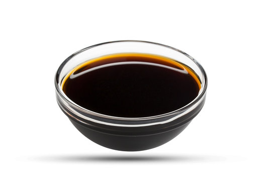 Soy sauce in glass bowl isolated on white background, with clipping path