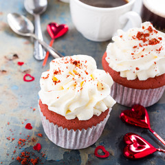 Delicious red velvet cupcakes on rusty old metal background. Valentines Day food.