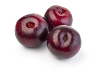 plums are isolated on a white