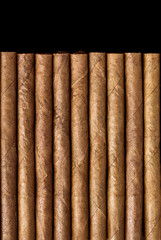 Cigars on black table