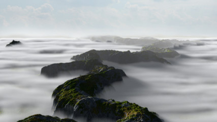 beautiful mountain range landscape with low crawling clouds