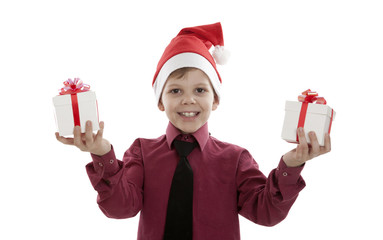 portrait of a little boy with gift boxes