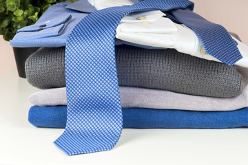 set of men's clothing on wooden background.