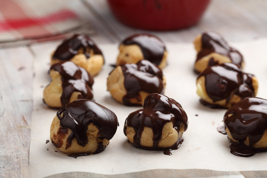 Profiteroles glazed with chocolate