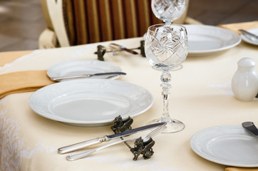 Served table in a retro luxury hotel restaurant close up