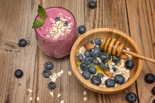 Healthy breakfast, granola and yogurt, fresh berries on rustic background.  granola and musli.