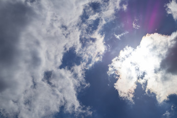 sunlight streaming through clouds