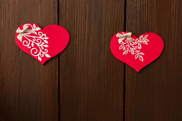 Fototapeta premium Valentine's day background with valentine card on wooden background