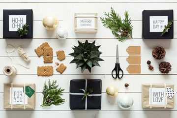 Elegant nordic retro christmas, wrapping station, desk view from above, DIY xmas concept