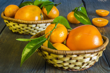mandarins and oranges on the wooden background