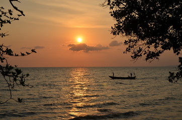 Kep,Cambodia. Fishing boat returns at sunset