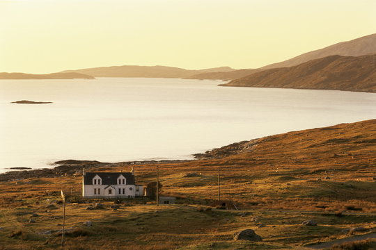 Sunset over Loch Tarbert and house, Isle of Harris, Outer Hebrides, Scotland