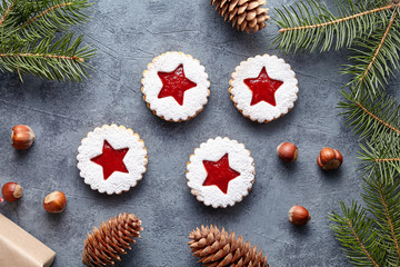 Obraz na płótnie Canvas Linzer star cookies with jam traditional Christmas baked sweet dessert shortbread food Xmas celebration pastry sugar powdered holiday snack