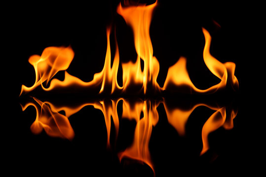 The fire on black glass with a reflection