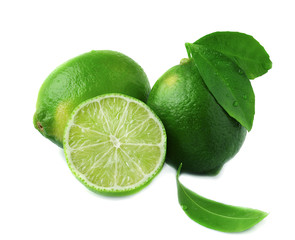 Fresh lime with leaf and water drops isolated on white