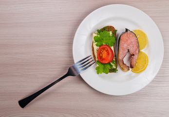 Delicious steak fillet red salmon fish on a plate.