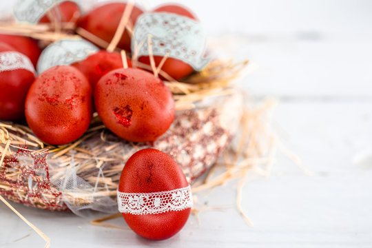 Red Easter eggs in a nest of hay