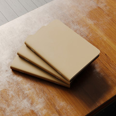 Concept of three blank notebook with brown craft paper cover on wooden desk. Empty horizontal mockup. 3d rendering