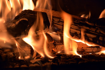 Firewoods at the fireplace. Closeup view, background