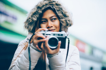 Freelancer asian photographer in a winter coat