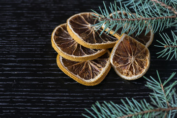 Christmas food frame and slice of orange on black background