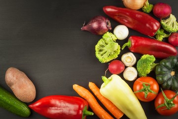 Freshly harvested organic vegetables on a wooden table. Vegetables on vintage wood background - autumn harvest. Rural still life from above with free text space.
