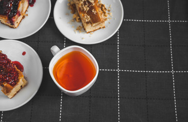 Hot tea with lemon and slices of pie