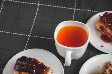 Hot tea with lemon and slices of pie