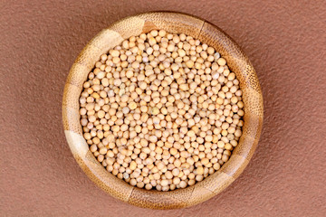 Mustard seeds in a bamboo bowl