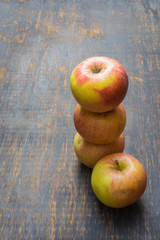 The red apples isolated on a wood.