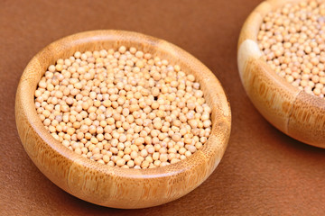 Mustard seeds in a bamboo bowls