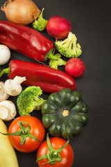 Freshly harvested organic vegetables on a wooden table. Vegetables on vintage wood background - autumn harvest. Rural still life from above with free text space.
