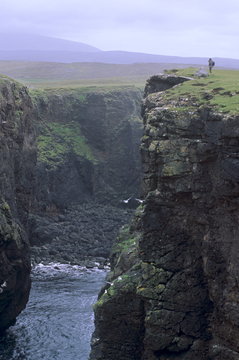 Eshaness basalt cliffs, Calder's Geo, ancient volcanic crater, coast deeply eroded with caves, blowholes and stacks, Northmavine, Shetland Islands, Scotland